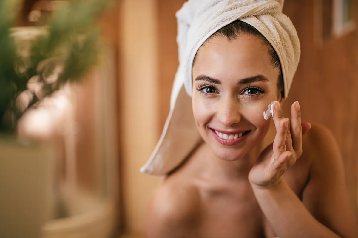 Figure 1: Applying adequate sunscreen using the two-finger rule ensures complete facial UV defense.